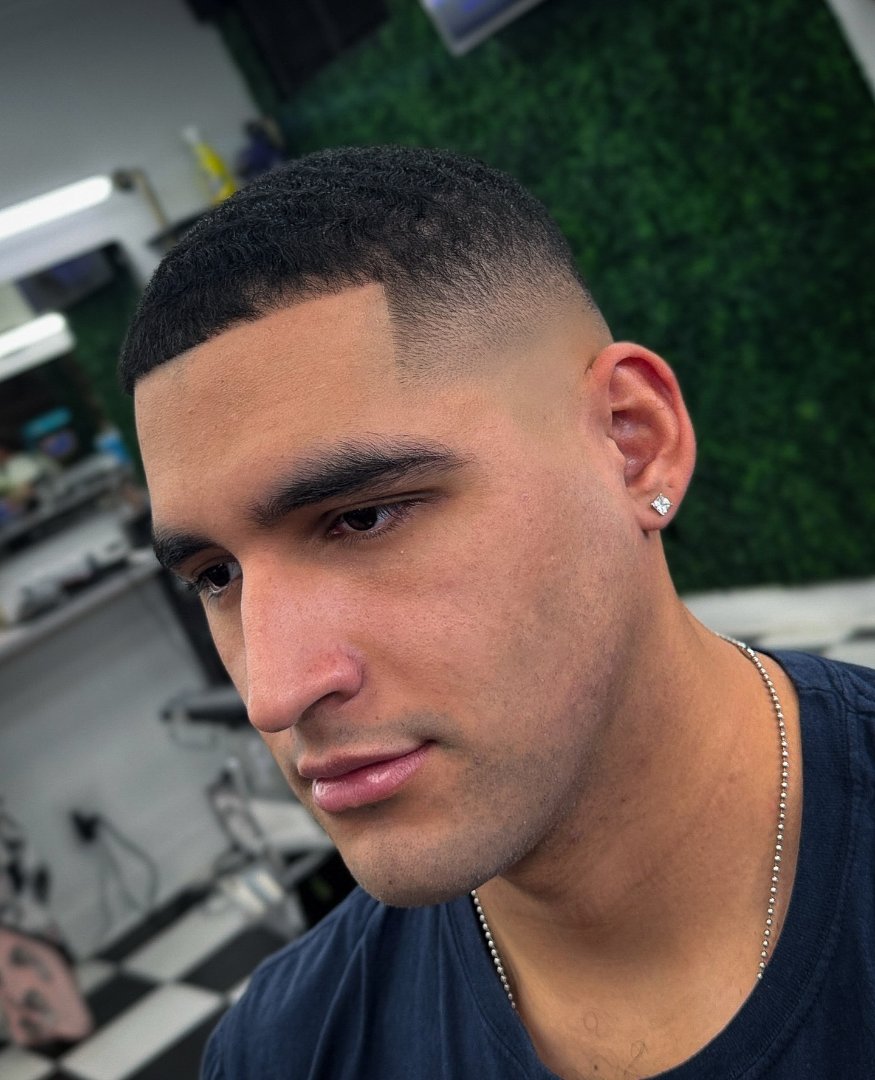 Skin fade with a sharp line-up by Marvin Suarez